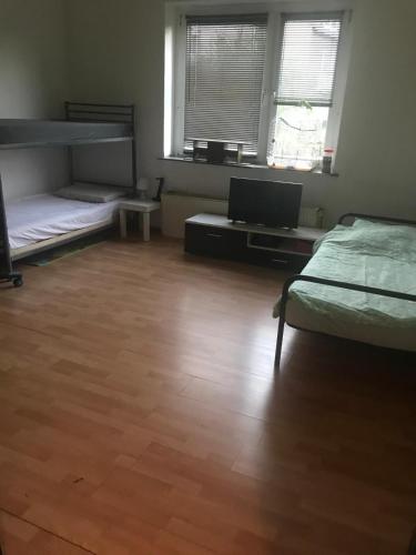 a room with two bunk beds and a laptop computer at MonteurRoomMR in Essen