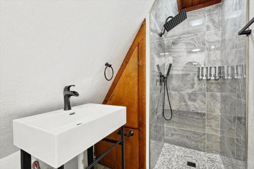 a bathroom with a sink and a shower at Peaceful 2BR 1BA Holiday Guest House with Hot Tub in Denton