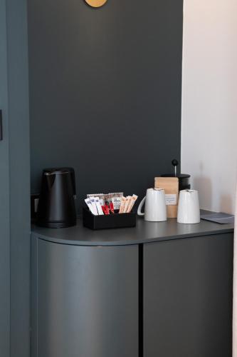a black table with a tray of items on it at Radisson Hotel Reims in Reims