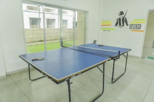 3BHK with Pool - Harmony Palace by Universe Villasの敷地内または近くにある卓球施設
