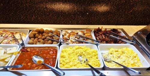 a tray of food with different types of food at Royal Regency Palace Hotel in Rio de Janeiro