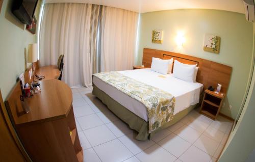 Кровать или кровати в номере Comfort Hotel Manaus