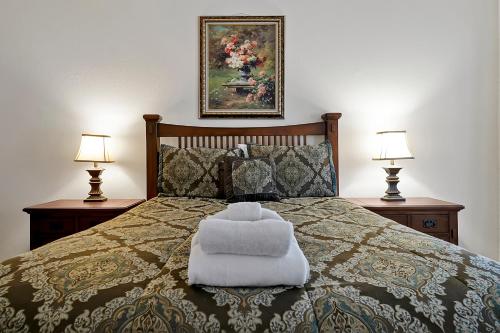 a bedroom with a bed with a white pillow on it at Entire home w/ Private Pool,Gated Near Disney in Orlando