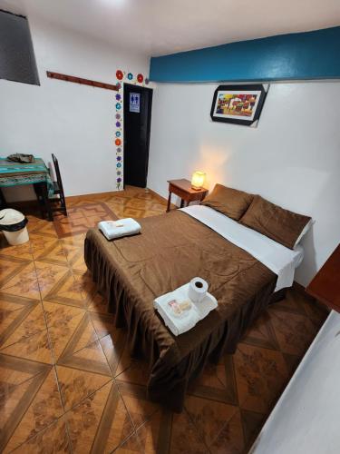 Giường trong phòng chung tại Hotel Huaraz