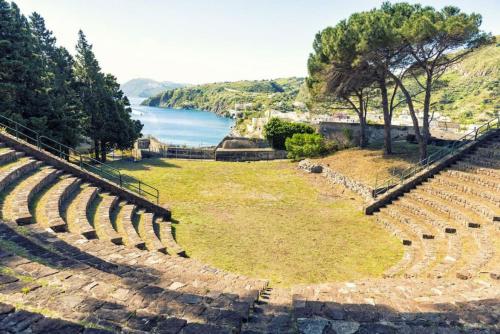 an amphitheater with a view of the water at Via Roma 55 in Lipari