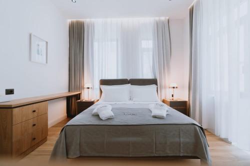 Postel nebo postele na pokoji v ubytování Dyrmo Hotel