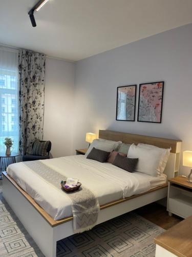 a bedroom with a large bed in a room at Eleganza Marina Apartments KAEC in King Abdullah Economic City
