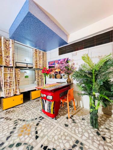 a room with a ping pong table and a plant at Hotel Moon Light Palace in Jaipur