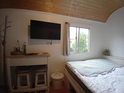 Ένα ή περισσότερα κρεβάτια σε δωμάτιο στο Tiny House Landei