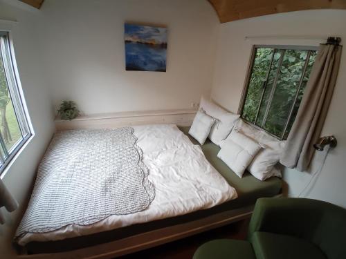 Ένα ή περισσότερα κρεβάτια σε δωμάτιο στο Tiny House Landei