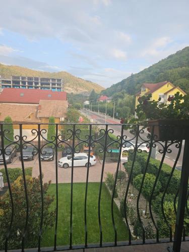 a balcony with a view of a parking lot at Casa Vladeasa in Caciulata