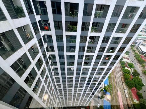 an overhead view of a tall white building at 80m2, 3BR apt - cozy & peaceful - City Center in Hai Phong