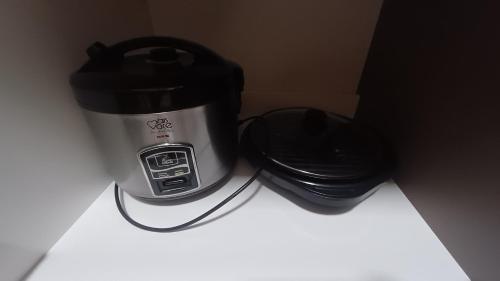 a toaster and a trash can on a counter at Vista Piscinas - Park Veredas 417 in Rio Quente