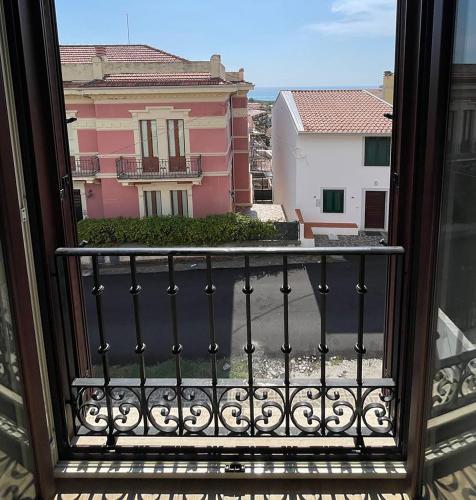 a view of a building from a balcony at I Registi in Scalea