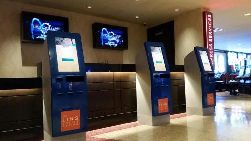 a lobby with two ticket machines in a building at The LINQ Hotel & Casino, A Caesars Destination in Las Vegas