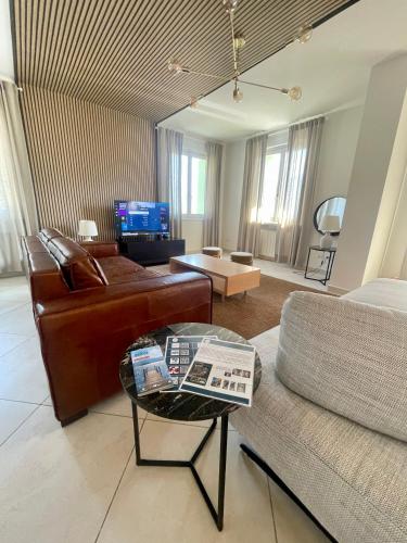 a living room with a couch and a table at Casa di Giulia in Lovere
