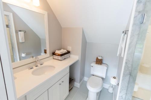 a bathroom with a sink and a toilet at The East Island Reserve Hotel in Middletown