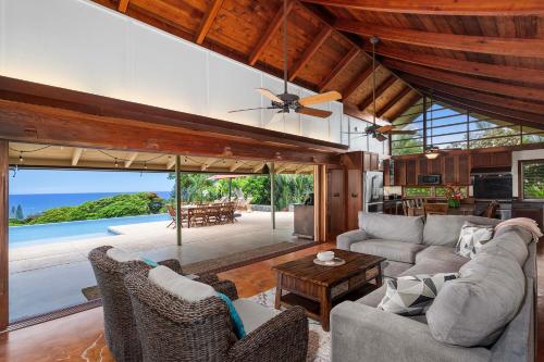 a living room with a couch and a table at Hale Joli in Kailua-Kona