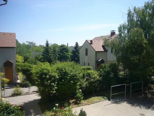 a group of houses with trees and bushes at Apartment Mödling in Mödling