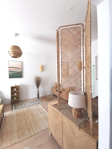 a room with a mirror and a lamp on a dresser at Apartment Krisz in Budapest