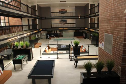 a large room with tables and benches in a building at Park Plaza Resort - Park City, Ascend Collection Hotel in Park City