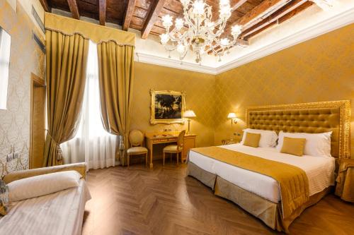 Postel nebo postele na pokoji v ubytování Palazzo dei Mori