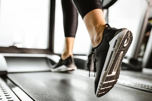 a person running on a treadmill at voco The Tuxon by IHG in Tucson