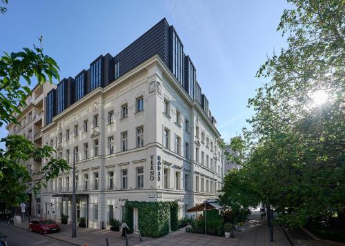 a large white building on a city street at Verno House Budapest, Vignette Collection by IHG in Budapest