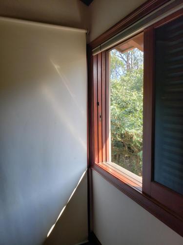 an empty room with a window with a view at Pousada Monte Sião in Sao Paulo