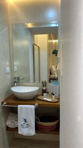 a bathroom with a white sink and a mirror at Pao Pao Hotel Islas del rosario in Isla Grande