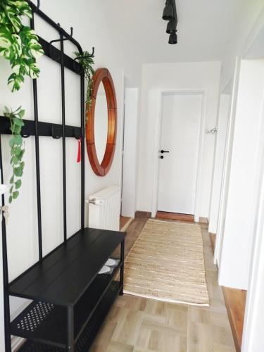 a living room with a black table and a rug at Apartman Alfa in Smederevo