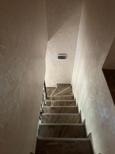 a stairway in a building with a stair case at Villa in Tsikhisdziri in Boboqvat'i