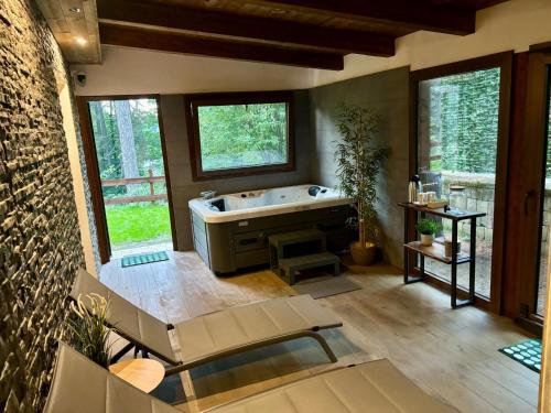 a bathroom with a tub and a sink at Rifugio Federici Home & Spa in Camigliatello Silano