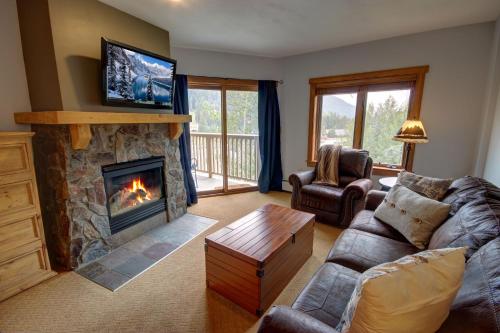 a living room with a couch and a fireplace at Red Hawk Lodge 2275 by SummitCove Lodging in Keystone