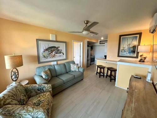 a living room with a couch and a table at Sunflower 3 in St. George Island