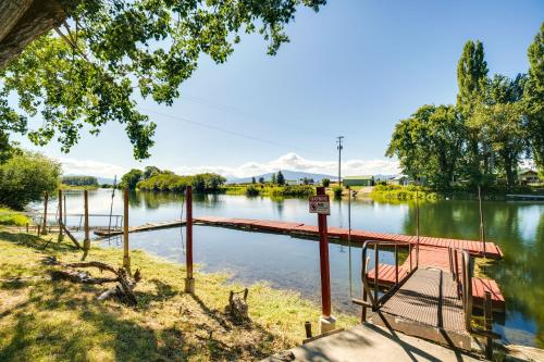 a bridge over a river with a bench at Riverfront Resort Cabin about 21 Mi to Crater Lake! in Chiloquin