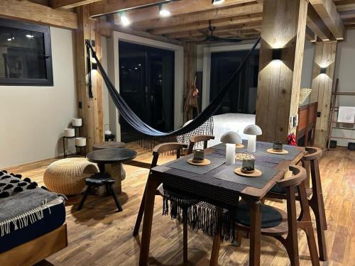 a room with a hammock and a bedroom at KINEKI La Punta - Casa Karen in Brisas de Zicatela