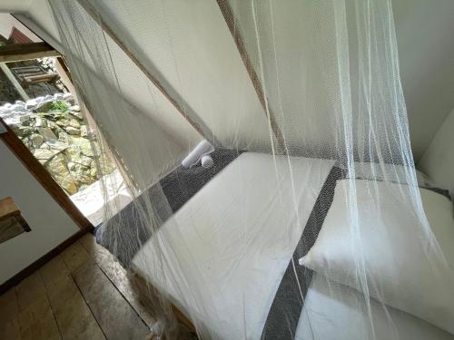 Cascada escondida glampingにあるベッド