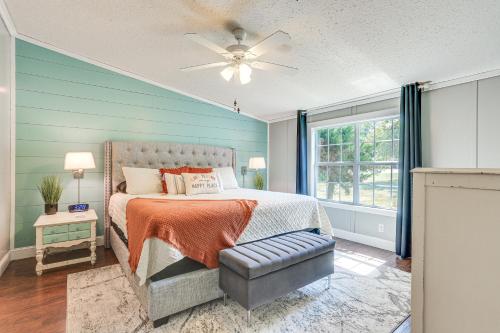 a bedroom with a bed and a ceiling fan at Upscale Lake Texoma Vacation Home 1 Mi to Marina! in Willow Spring