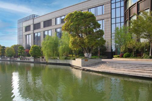 a building with a river in front of it at InterContinental Changzhou by IHG in Changzhou