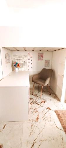 a room with a desk and a chair on the floor at Spirit of Gozo unique penthouse in Xagħra