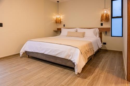 Postel nebo postele na pokoji v ubytování Monte Pueblo Hotel Boutique