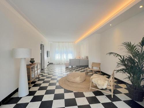 a large living room with a couch and a bed at Hestia in Oudsbergen 