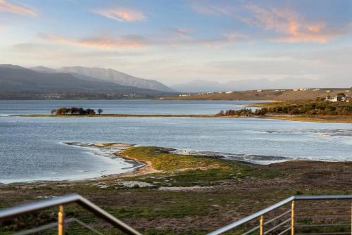 a view of a body of water with mountains at Flamingo Bay Manor in Fisherhaven
