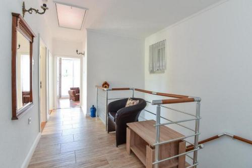 a living room with a couch and a stair case at Seaside holiday house Zaton Veliki, Dubrovnik - 23195 in Zaton
