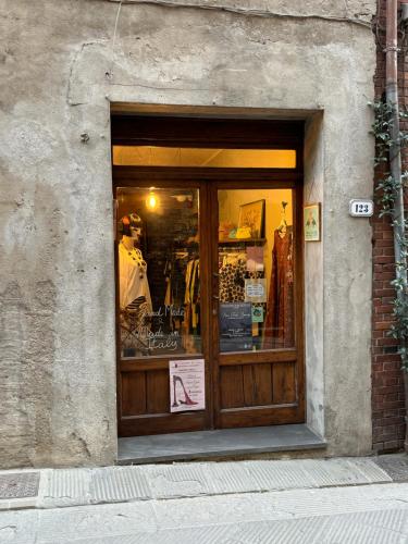 a storefront window of a store with a sign in it at 2 King Bed, 2 Full Bathroom Apartment in Umbria - Tuscany in Città della Pieve