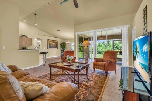 a living room with a couch and a table at Casa Dell'Amore in Murdock