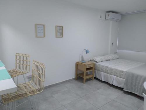 Ένα ή περισσότερα κρεβάτια σε δωμάτιο στο Depto. Céntrico La Plata