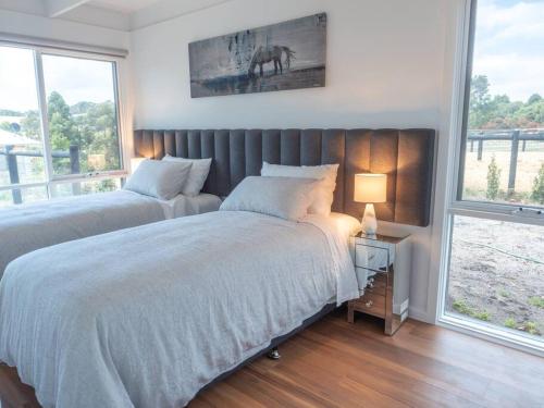Ένα ή περισσότερα κρεβάτια σε δωμάτιο στο Gracie's Lane Villa 2