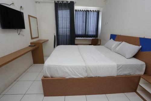 Ένα ή περισσότερα κρεβάτια σε δωμάτιο στο Apartement Riverview Tower Mahakam by Alfa Rooms